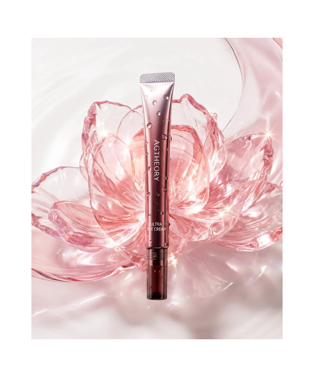 AXXZIA AGTheory Ultra Eye Cream – tubka z aplikatorem wśród różowych płatków kwiatów, elegancki lifestyle